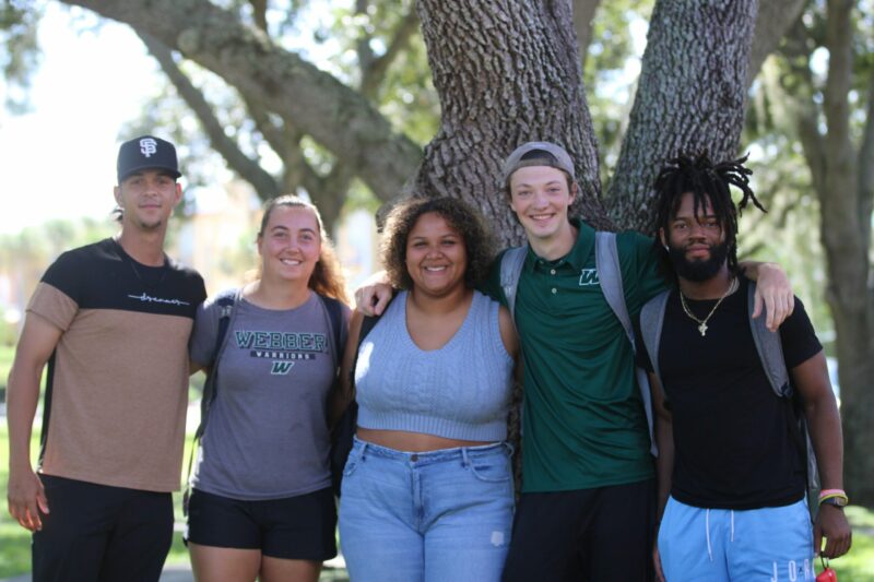 webber students in front of tree